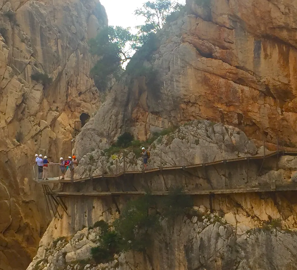 The boardwalk path of Caminito del Rey clinging to the cliff face above the gorge
